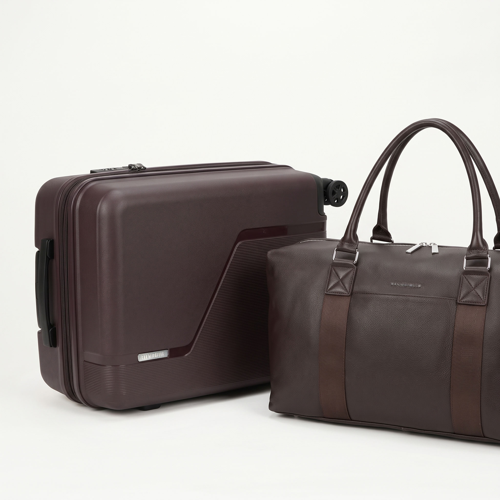 Dark brown San Michelle hard shell suitcase with a matching leather holdall