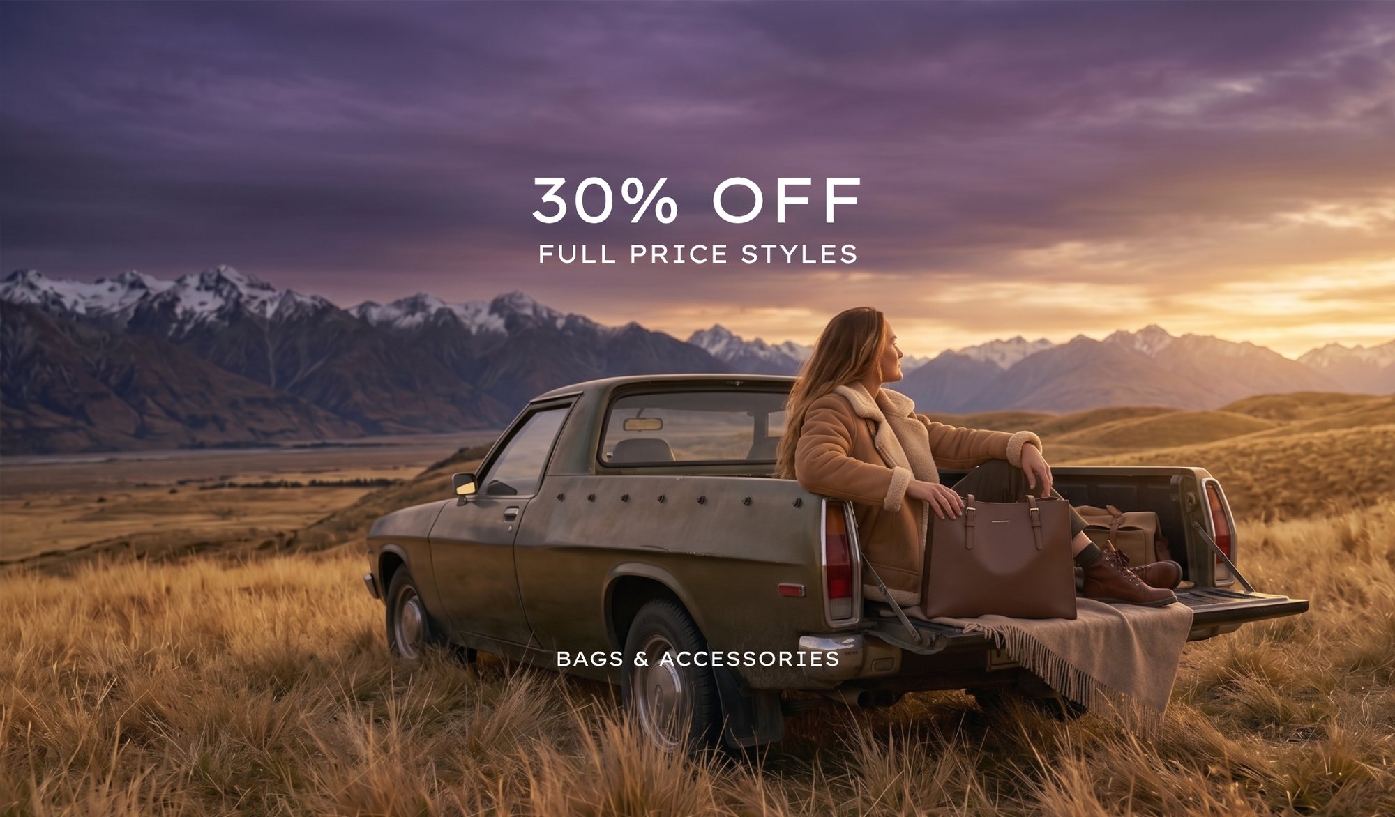 Traveller with San Michelle leather bags on the tray of a classic ute in the high country, 30 percent off full price styles